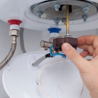 boiler maintenance best practices includes replacing faulty parts, as seen in this image