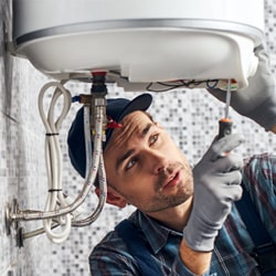 homeowner making adjustments for winter boiler preparation