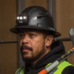 Click here to see Klein 60346 Klein Non-Vented Hard Hat with Rechargeable Headlamp, Full Brim, Class E, Premium KARBN Pattern - 60346