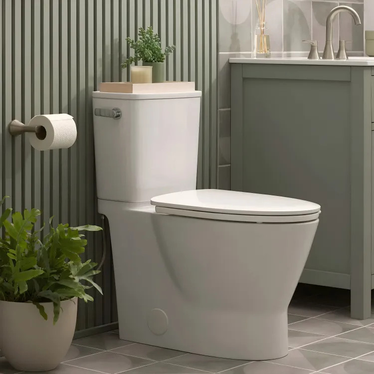 American Standard Aspirations Skirted Two-Piece Elongated Toilet w/ Seat, 1.28 GPF, Left Trip Lever, White - 252AA899.020
